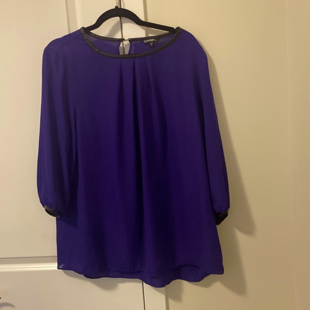 Rich purple blouse.